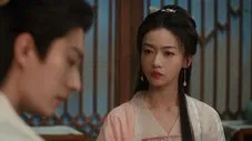Primer plano de un hombre y una mujer con atuendos tradicionales chinos posiblemente del Episodio 1